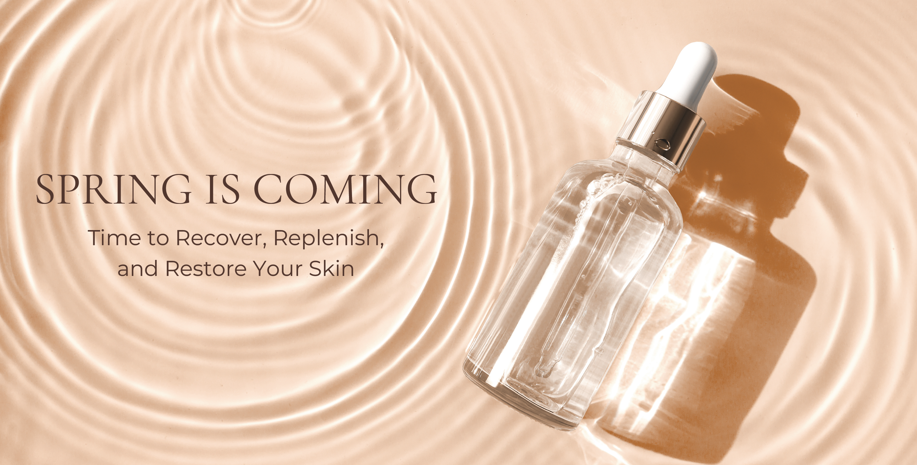 Spring Is Coming Time to Recover, Replenish, and Restore Your Skin  Clear serum Bottle with white dropper and silver collar laying in water with peach background.